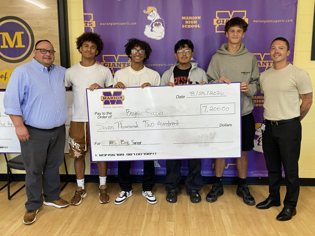 photo - MHS boys soccer team gathers to receive a donation from MHSAA on 8/25/26